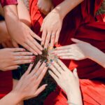 A vibrant top view of women showcasing painted nails and rings, emphasizing friendship and togetherness.